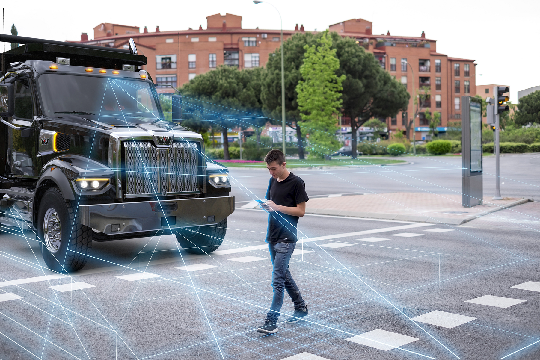 A truck with stylized radar lines extending from the monitors to showcase how the Detroit Assurance safety system's Active Brake Assist detects people and other objects.